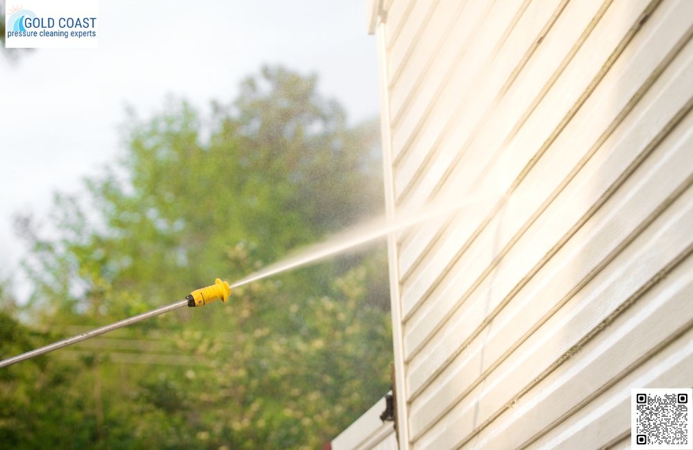 How do you clean concrete areas like pathways and garages?
